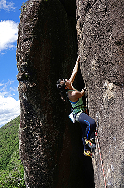 Rock climber in action at Anhangava, Curitiba, Brazil, South America