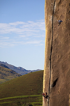 Two climbers tackle a difficult route on a huge buttress on the Tsaranoro Massif, Andringitra National Park, Madagascar, Africa