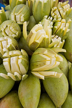 Sliced raw mangoes displayed for sale, Kanyakumari, Tamil Nadu, India, Asia