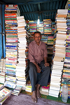 College Street bookstall holder, the world's largest second hand book market for intellectuals, scholars, and students, Kolkata (Calcutta), West Bengal, India, Asia