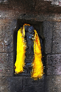 One of the 64 Jogini statues in the Chausathi Jogini Mandir, draped with a shawl as a puja, Hirapur, Odisha, India, Asia