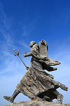 Statue of 7th century monk, Xuanzang, carrying Buddhist sutras, Gaochang ruins, Xinjiang, China, Asia