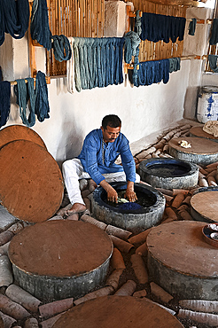 Demonstration of centuries old traditional Ajrakh indigo dyeing of skeins of locally spun cotton, Ajrakhpur, Bhuj, Gujarat, India, Asia