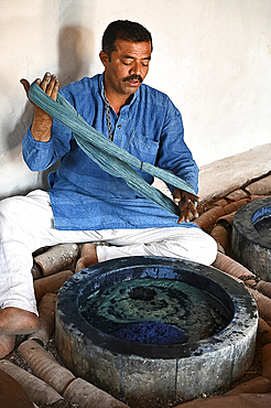 Demonstration of centuries old traditional Ajrakh indigo dyeing of skeins of locally spun cotton, Ajrakhpur, Bhuj, Gujarat, India, Asia