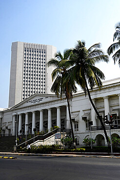 Modern skyscraper block towers above the 200 year old Asiatic Society Library and Town Hall built in 1804, Mumbai, India, Asia