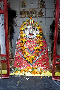 Hindu street shrine, decorated with marigold mala (garlands) for Diwali festival, Udaipur, Rajasthan, India, Asia