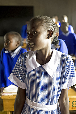 Schoolgirl listening to teacher in a lesson, Karunga Primary School, Rift Valley, Kenya, East Africa, Africa