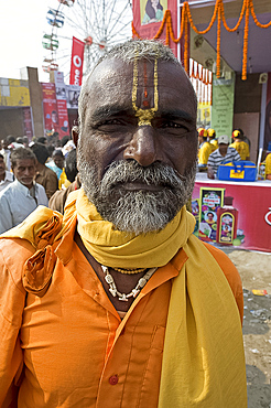 Bihari villager, a Vishnaivite devotee with tilak on his forehead indicating the Hindu god Vishnu, wearing orange clothing for visit to the Vishnu temple at Sonepur Cattle Fair, near Patna, Bihar, India, Asia