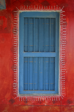 Decorated shuttered window in painted bhunga wall, Dhordo village, Kachchh, Gujarat, India, Asia