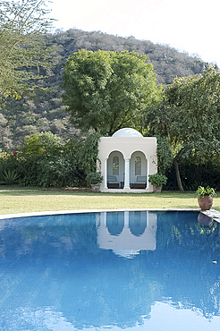 Arched Moghul folly in a quiet garden, Haryana, India, Asia