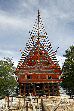 Construction of traditional style Batak house with bamboo scaffolding, beside the volcanic Lake Toba, Samosir Island, Sumatra, Indonesia, Southeast Asia, Asia