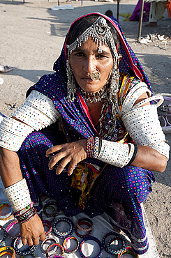 Mir tribeswoman wearing traditional Mir tribal jewellery and married woman's bangles, Dasada, Gujarat, India, Asia