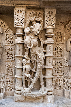 Carved dancing girl on wall of Rani ki Vav, 11th century stepwell dedicated to Hindu god Lord Vishnu, Patan, Gujarat, India, Asia