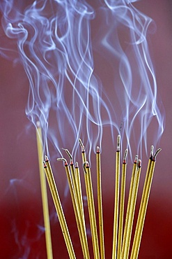 Incense sticks on joss stick pot burning, smoke used to pay respect to the Buddha, Vung Tau, Vietnam, Indochina, Southeast Asia, Asia