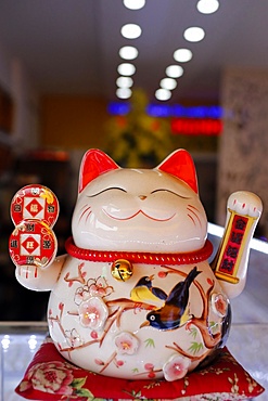 Lucky Cat in shop symbolizing good luck and good fortune, Ho Chi Minh City, Vietnam, Indochina, Southeast Asia, Asia