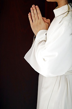 Altar girl praying, Catholic church, Sunday Mass, Ho Chi Minh City, Vietnam, Indochina, Southeast Asia, Asia