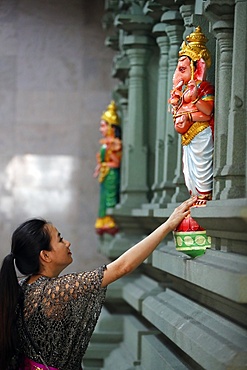 Woman praying to Hindu deity Ganesh, Sri Mahamariamman Hindu Temple, Kuala Lumpur, Malaysia, Southeast Asia, Asia