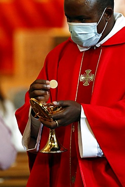 Coronavirus epidemic (Covid-19), Celebration of the Pentecost Mass after lockdown, Holy Communion, Saint Louis de Novel Church, Annecy, Haute Savoie, France, Europe