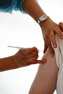 COVID-19 vaccination center, man receiving his first Covid 19 vaccination, France, Europe