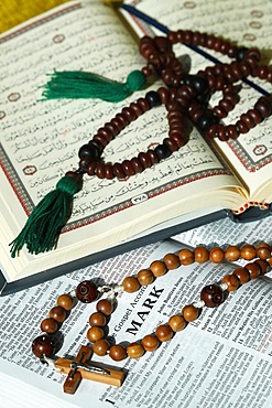 Bible, Quran, Crucifix and Prayer Beads, interfaith symbols of Christianity and Islam, the two largest religions in the world, Dubai, United Arab Emirates, Middle East