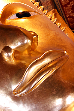 Wat Pho (Temple of the Reclining Buddha), detail of face of big reclining golden Buddha statue (Phra Buddhasaiyas), Bangkok, Thailand, Southeast Asia, Asia