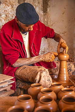 Potter at work in a workshop, Safi, Morocco