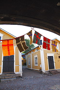 Decorative flags and medieval wooden houses, Porvoo, Uusimaa, Finland, Scandinavia, Europe