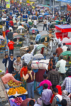 Busy rickshaw traffic on a street crossing in Dhaka, Bangladesh, Asia