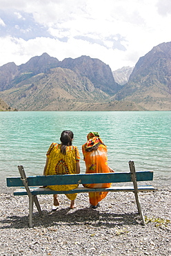 Bench at turquoise Iskanderkul Lake (Alexander Lake) in Fann Mountains, Iskanderkul, Tajikistan, Central Asia