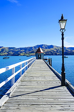 Long wooden pier in Akaroa, Banks Peninsula,Canterbury, South Island, New Zealand, Pacific