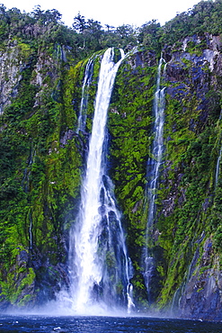 Huge waterfall in Milford Sound, Fiordland National Park, UNESCO World Heritage Site, South Island, New Zealand, Pacific