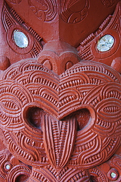 Traditional wood carved mask in the Te Puia Maori Cultural Center, Rotorura, North Island, New Zealand, Pacific