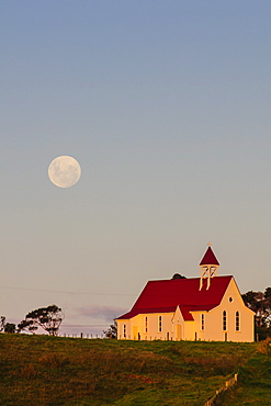 Full moon behind a little chapel, Westcoast, Northland, North Island, New Zealand, Pacific