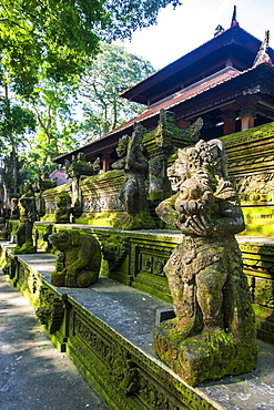 Overgrown statues in a temple in the Monkey Forest, Ubud, Bali, Indonesia, Southeast Asia, Asia