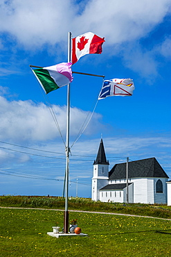 Flag pole in front of a church in Flower Cove, Newfoundland, Canada, North America