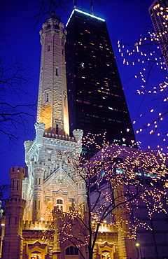 Water Tower and the John Hancock Center illuminated at night at Christmas time, Chicago, Illinois, United States of America, North America