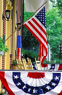 Flag displayed on porch with bunting, Chautauqua, New York, United States of America, North America