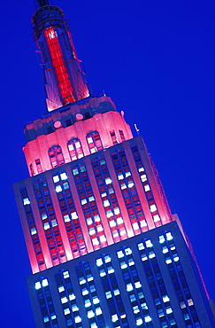 Empire State Building illuminated at night with Christmas lighting, New York City, New York, United States of America, North America