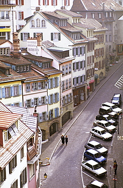 Two women walking down a street, Lausanne, Switzerland, Europe