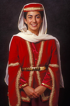 Portrait of teenager about 16 years old dressed in traditional special occasion dress of Armenian heritage, Armenia, Central Asia, Asia