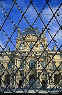 The Louvre reflected in the Pyramid by I M Pei, Paris, France, Europe