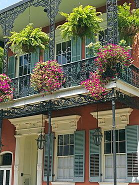 Colorful French Quarter residential street with wrought iron balconies and hanging flower baskets, New Orleans, Louisiana, United States of America, North America