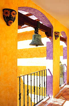 Colorful corridor in hotel with antique brass bell, Playa del Carmen, Yucatan, Mexico, North America