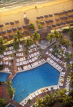 Aerial view of beach with pool and palapas on the beach, Acapulco, Mexico, North America