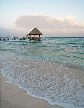 Pier with palapa jutting out into the water from the beach, Mayan Riviera, Akumal, Yucatan, Quintana Roo, Mexico, North America