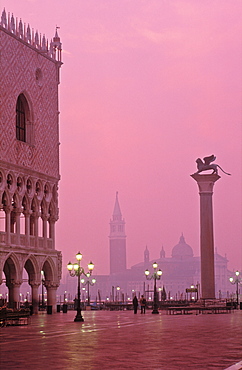 View of San Giorgio Maggiore from Piazzetta San Marco and the column of San Marco with a pink sky at dawn, Venice, UNESCO World Heritage Site, Veneto, Italy, Europe