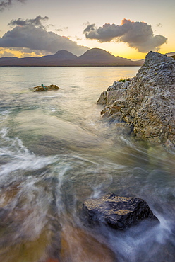 Isle of Jura and Paps of Jura Mountains across Bunnahabhain Bay and Sound of Islay from Islay, Argyll and Bute, Scotland, United Kingdom, Europe