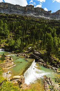 Sierra de las Cutas on the south rim above a Rio Arazas waterfall, Ordesa Valley, Ordesa National Park, Pyrenees, Aragon, Spain, Europe