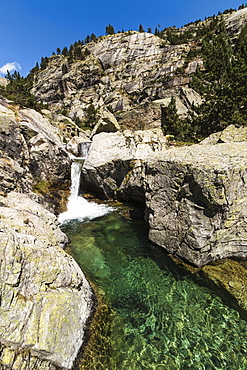 Crystal clear waterfall pool in the Rio Caldares valley north of Banos de Panticosa, Panticosa, Pyrenees, Huesca Province, Spain, Europe