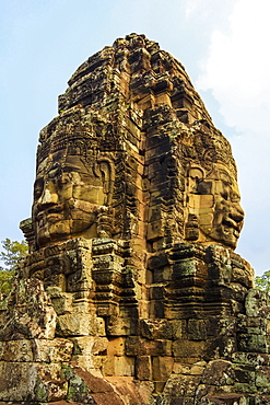 Tower with two of the 216 smiling sandstone faces at 12th century Bayon temple in Angkor Thom walled city, Angkor, UNESCO World Heritage Site, Siem Reap, Cambodia, Indochina, Southeast Asia, Asia